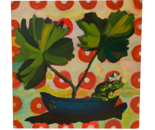 Green frog wearing a paper boat hat sitting on the edge of a blue boat with two large green leaves as sails, set on a on a colorful red dotted background.